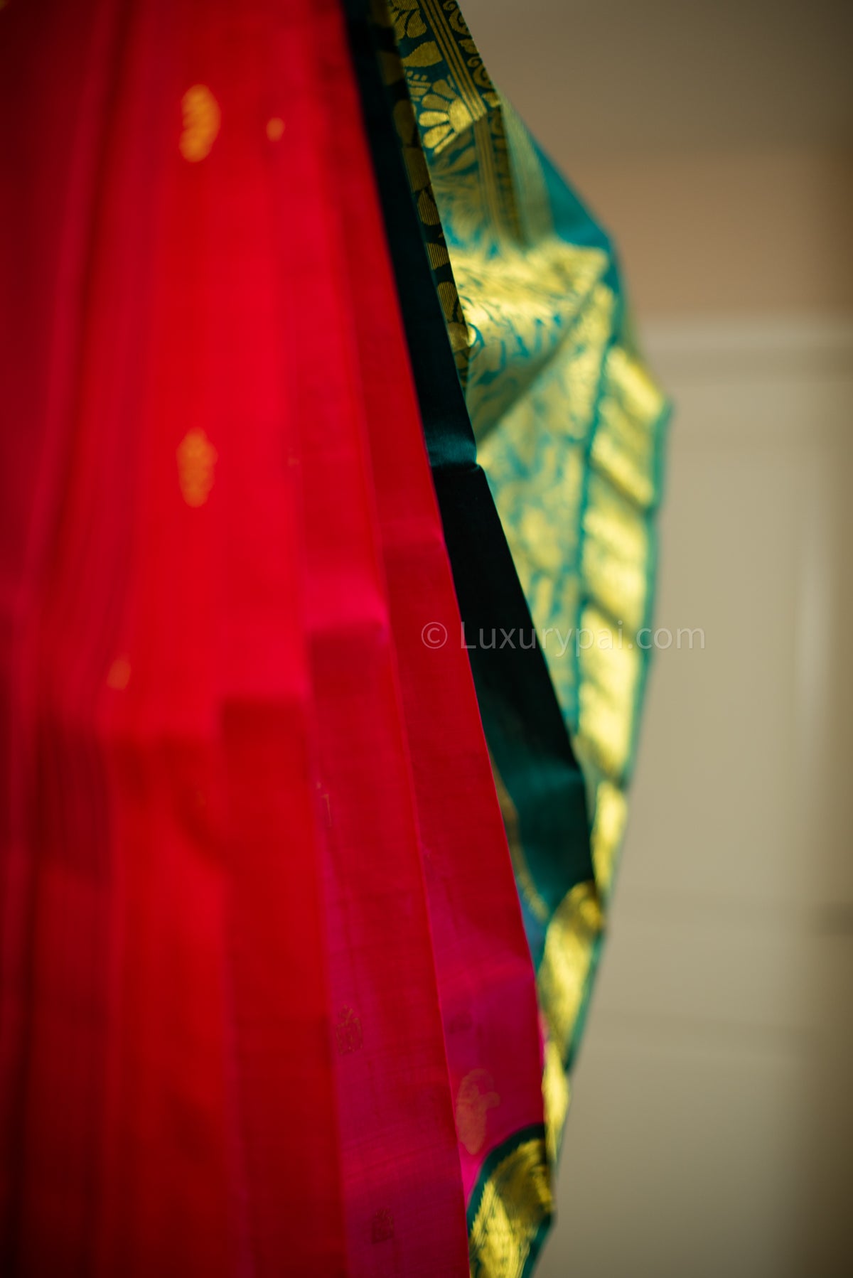 Stunning Tomato Red Kanchipuram Pattu Saree with Mango Golden Butta Design