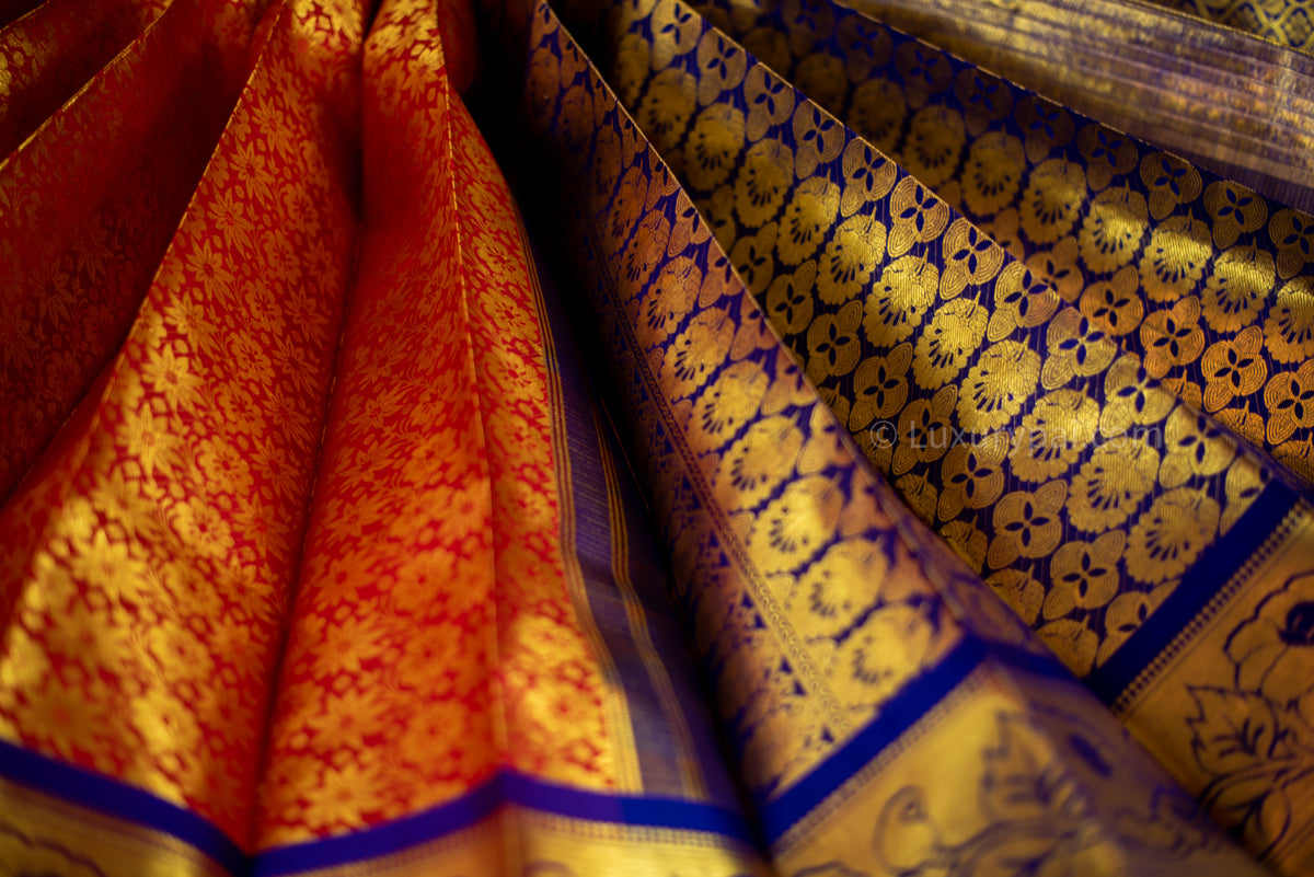 Gorgeous Tomato Red Kanchipuram Pattu Saree with Floral Design - A Must-Have for Any Bride or Woman Looking for a Luxurious and Elegant Piece