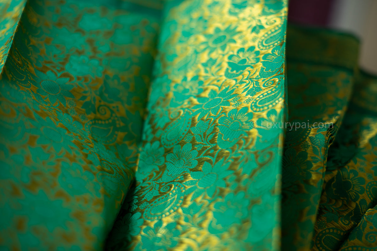 Rexona Green Kanchipuram Silk Saree: Handloom Kai Korvai Weave with Lush Multi-Flower & Chakkara Poo Motifs