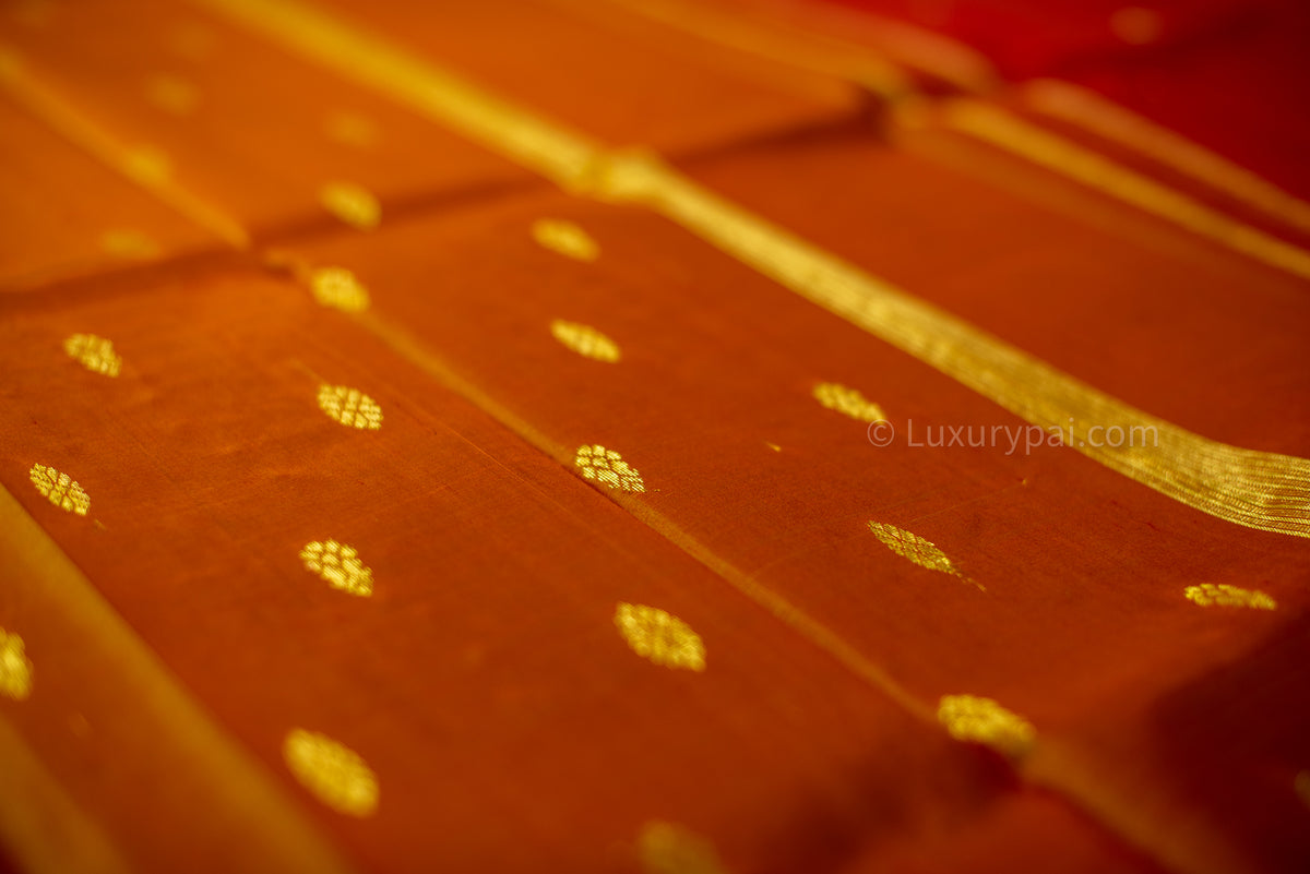 Kumkumam & Fenugreek Kanchipuram Silk Saree: Elegant Butta Motif with Handwoven Kai Korvai Technique