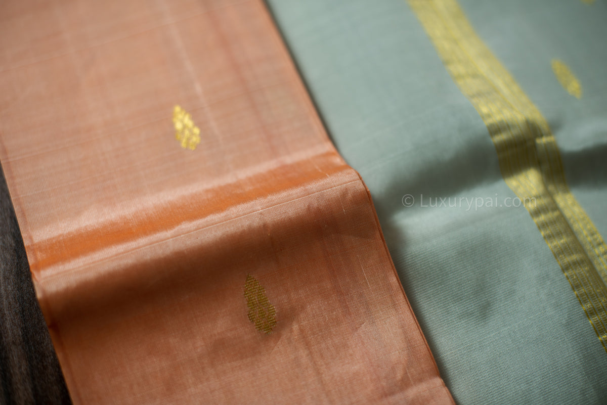 Refined Kanchipuram Silk Saree in Vibrant Kanakambaram Hue with Exquisite Butta Motifs - Artisanal Kai Korvai Weaving with Sophisticated Grey Border